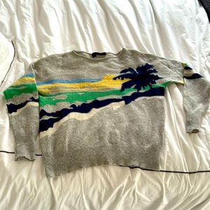 360 degree cashmere sweater with palm tree, sun and sky. Cozy cashmere.
